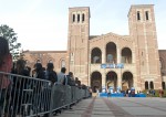 Students stand in a line outside of Royce Hall that extends to Janss Steps as they wait to see the world premiere of the 12th season of “American Idol.”