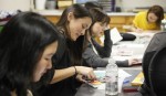 The Art Shaped Box club meets every week at Sunset Recreation Center where students work on different weekly art projects. Vanessa Goh, fourth-year environmental science student, works on an art work with color pastels.