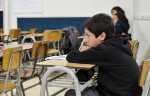 A Chilean first-grader keeps an eye on the whiteboard during class. Protesters say that unequal access to higher education starts in elementary school, since wealthier students can attend better schools.