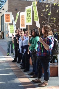 UC service and patient care workers hold signs outside Sproul Hall after extended negotiation with the University over their contracts. 