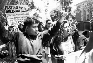 Students hold signs during a 1993 protest advocating the creation of a Chicana and Chicano studies department. A Chicano studies interdepartmental program was created in 1973, but it was not made a department until 1993.