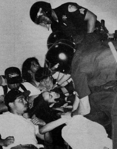 Police officers remove students from the UCLA Faculty Center during a demonstration on May 11, 1993. More than 150 students participated in the protest.