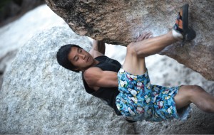 Third-year environmental science student Daniel Fong trained at the climbing wall in the John Wooden Center so he could clamber up inverted surfaces when climbing outdoors.