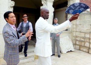 Feodor Chin as Cecil Graham, Brian Slaten as Lord Darlington, Owiso Odera as Lord Windermere and  Peter Wylie as Lord Augustus make use of the library's spacious grounds in the new series of outdoor performances "Arts on the Grounds."