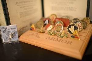 About two dozen military certificates and service medals decorate a bookshelf in Jose Buktaw's home. Few people say anything about them, Buktaw said.