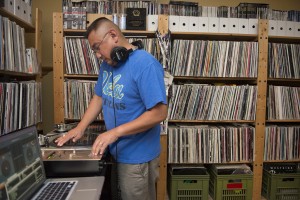 UCLA student Jose Buktaw plays music from his collection of more than 8,000 records on his turntable. For around 30 years, he has been a DJ at hip-hop events around the world, including Tokyo, Orlando and New York.