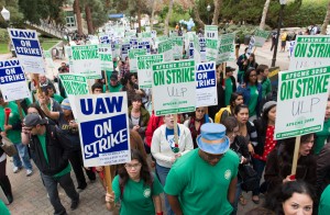 Striking union members and sympathy strikers march up Bruin Walk on Wednesday.