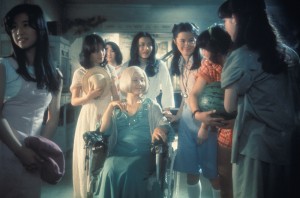 Kumiko Oba ("Fantasy"), Masayo Miyako ("Sweet"), Eriko Tanaka ("Melody"), Kimiko Ikegami ("Gorgeous"), Ai Matsubara ("Prof"), Mieko Sato ("Mac"), Miki Jinbo ("Kung Fu"); seated: Yoko Minamida ("Gorgeous's Aunt")