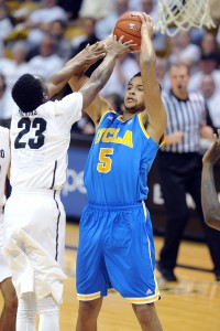 Kyle Anderson of UCLA tries to shoot over Jaron Hopkins of CU during the first half of the January 16, 2014 game in Boulder. For more photos of the game, go to www.dailycamera.com.