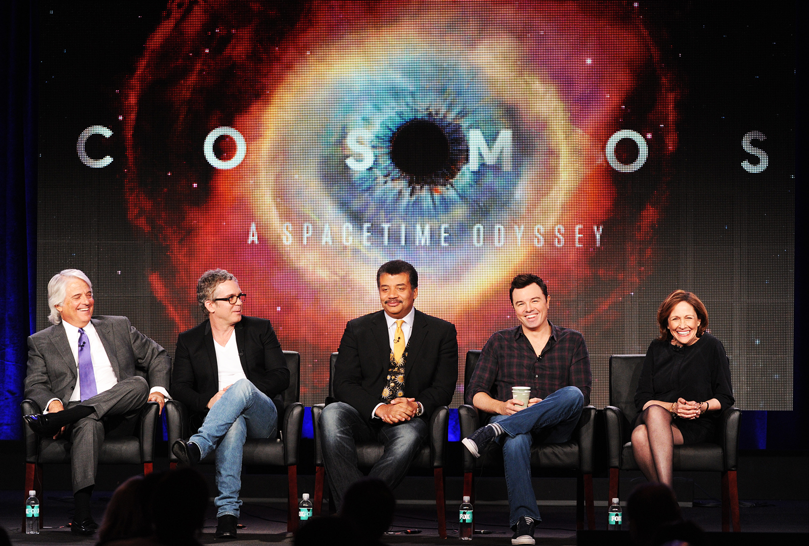 A panel featuring some of the talent that put together "Cosmos" (from left to right): executive producer Mitchell Cannold, director Brannon Braga, host Neil deGrasse Tyson, executive producer Seth MacFarlane and director Ann Druyan. (Courtesy of Frank Micelotta)