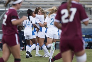 Senior forward Rosie White celebrated with senior midfielder Sarah Killion after the two Bruins executed a trick play that created UCLA's first goal against LMU. (Aubrey Yeo/Daily Bruin senior staff)