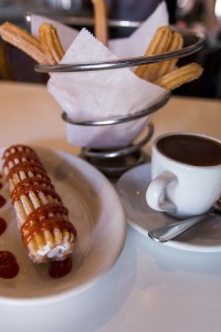 Two miles south of UCLA, Churros Calientes serves Venezuelan and Spanish-style churros. The shop offers combinations such as the churro grande, stuffed with cream cheese and topped with guava sauce, and churros con chocolate. (Mary Kate Turner/Daily Bruin)