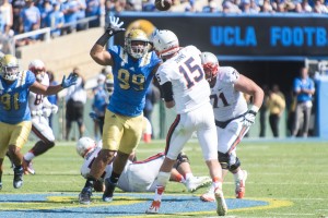 Defensive end Matt Dickerson showed improved pass rushing ability in the season opener. The sophomore only had one tackle in the entire 2014 season, but had two strong quarterback pressures and one pass deflection against Virginia. (Daniel Alcazar/Daily Bruin senior staff)