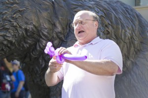 David Perkins first learned how to tie balloons while performing in Jerusalem as part of the New Jerusalem Magic Whoopee Band. He made balloon animals for religious pilgrims, Israeli soldiers and government officials. (Jennifer Hu/Daily Bruin)