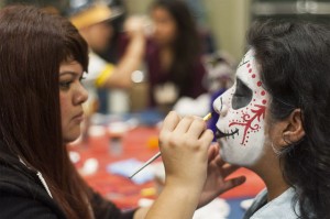 First-year pre-business economics student Daisy Garcia and first-year human biology and society student Viviana Rodriguez participated in the face painting for Dia de los Muertos on the Hill on Sunday. (Esmerelda Lopez/Daily Bruin)